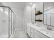 Contemporary bathroom with double vanity, modern mirrors, and a glass-enclosed shower at 2844 Pinelog Ln, Johns Island, SC 29455