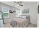 Cozy bedroom featuring neutral carpet and walls and natural light from the large window at 2844 Pinelog Ln, Johns Island, SC 29455