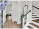 Bright foyer with hardwood floors, staircase, and an open view into the living area at 2844 Pinelog Ln, Johns Island, SC 29455