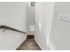 Bright staircase with wooden stairs and handrail leading to an upper level at 2844 Pinelog Ln, Johns Island, SC 29455