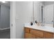 Bathroom vanity with a wood cabinet, white counter, mirror, and modern fixtures at 300 Greens Ct, Goose Creek, SC 29445