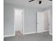 Neutral bedroom with a carpet, a closet, and doorway leading to another room at 300 Greens Ct, Goose Creek, SC 29445