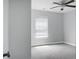 A spacious bedroom with neutral paint, carpet and featuring a ceiling fan, and a window with bright light at 300 Greens Ct, Goose Creek, SC 29445