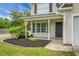 Close-up of the home's charming front porch, showing the well-maintained landscaping and welcoming entrance at 300 Greens Ct, Goose Creek, SC 29445