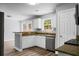 Modern kitchen features stainless steel appliances, granite countertops, and ample cabinet space at 300 Greens Ct, Goose Creek, SC 29445