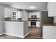 Functional kitchen features stainless steel appliances, granite countertops and generous cabinet space at 300 Greens Ct, Goose Creek, SC 29445