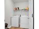 A laundry room with white washer and dryer and shelving at 300 Greens Ct, Goose Creek, SC 29445