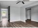 Open-concept living room highlighting modern flooring, neutral tones, and a ceiling fan at 300 Greens Ct, Goose Creek, SC 29445