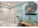 A charming aqua bathroom featuring a shower, toilet, and a unique glass sink at 3002 Edenvale Rd, Johns Island, SC 29455