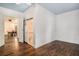 Spacious bedroom featuring hardwood floors, ensuite bathroom and views into dining room at 3002 Edenvale Rd, Johns Island, SC 29455