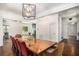 Open-concept dining room with a rustic table, bright lighting, and seamless flow to other living spaces at 3002 Edenvale Rd, Johns Island, SC 29455