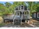 Close up of the exterior of a small building with green roof and white trim at 3002 Edenvale Rd, Johns Island, SC 29455