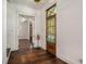 Bright foyer with hardwood floors, wooden front door, and inviting glimpse of the front porch at 3002 Edenvale Rd, Johns Island, SC 29455