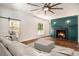Bright living room boasts a large fireplace, hardwood floors and access to the modern kitchen at 3002 Edenvale Rd, Johns Island, SC 29455