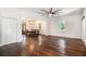 Spacious living room featuring hardwood floors, natural light, and open flow to the dining area at 3002 Edenvale Rd, Johns Island, SC 29455