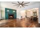 Open-concept living room with hardwood floors and fireplace flows into the dining area at 3002 Edenvale Rd, Johns Island, SC 29455