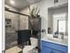 Modern bathroom featuring a tiled shower with black trim, a shower niche, and a black cabinet at 312 Silverdrop St, Goose Creek, SC 29445