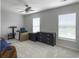 A bright bedroom with two windows and a dresser with neutral paint throughout the space at 312 Silverdrop St, Goose Creek, SC 29445