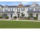 Charming townhouse featuring a covered entry, landscaped yard, and welcoming front door at 312 Silverdrop St, Goose Creek, SC 29445