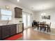Bright kitchen featuring stainless steel appliances, dark cabinets, and hardwood floors at 312 Silverdrop St, Goose Creek, SC 29445