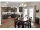 Modern kitchen with stainless steel appliances, dark cabinets, and adjacent dining area at 312 Silverdrop St, Goose Creek, SC 29445