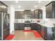 Well-equipped kitchen featuring stainless steel appliances, white countertops, and dark cabinetry at 312 Silverdrop St, Goose Creek, SC 29445