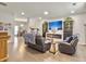 Spacious living room with modern fireplace, hardwood floors and plenty of natural light at 312 Silverdrop St, Goose Creek, SC 29445