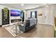 Bright living room featuring a modern fireplace, hardwood floors, and a relaxing seating area at 312 Silverdrop St, Goose Creek, SC 29445
