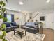 Comfortable living room featuring a staircase, stylish furniture, and a cozy atmosphere at 312 Silverdrop St, Goose Creek, SC 29445