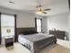 This bedroom features a ceiling fan, two windows with blinds, and neutral-toned walls and carpet at 312 Silverdrop St, Goose Creek, SC 29445