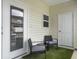 Cozy patio space with chairs, table and artificial grass flooring at 312 Silverdrop St, Goose Creek, SC 29445