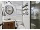 Cozy bathroom with a sink, mirror, decorative shelves, and walk-in shower at 313 Janice St, Goose Creek, SC 29445