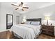 Comfortable bedroom features a ceiling fan, wood floors, and a nightstand with lamps at 313 Janice St, Goose Creek, SC 29445