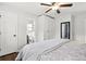 Clean bedroom showcases a ceiling fan, closet, and an en-suite bathroom at 313 Janice St, Goose Creek, SC 29445