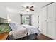 Bright bedroom with a ceiling fan, closet, and a window overlooking the yard at 313 Janice St, Goose Creek, SC 29445