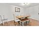 Cozy dining room with wood table, bench seating, and elegant light fixture at 313 Janice St, Goose Creek, SC 29445