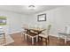 Cozy dining room with wood table, bench seating, and elegant light fixture at 313 Janice St, Goose Creek, SC 29445
