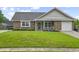 Charming single-story brick home with a well-maintained lawn and attached garage at 313 Janice St, Goose Creek, SC 29445