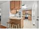 Kitchen featuring stainless steel appliances, a breakfast bar, and tile flooring at 313 Janice St, Goose Creek, SC 29445