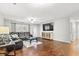 Inviting living room featuring a leather sofa, a TV, hardwood floors and lots of light at 313 Janice St, Goose Creek, SC 29445