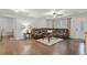 Spacious living room with a leather sofa, hardwood floors, and a ceiling fan at 313 Janice St, Goose Creek, SC 29445