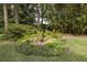 Lush landscaping creates a tranquil atmosphere in the property's backyard at 34 Formosa Dr, Charleston, SC 29407