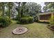 Spacious backyard includes mature landscaping and decorative ground compass at 34 Formosa Dr, Charleston, SC 29407