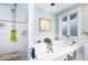 Bright bathroom with a soaking tub, shower and patterned window at 34 Formosa Dr, Charleston, SC 29407