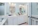 Bright bathroom with dual sinks, vanity, and decorative accents creating a refreshing and functional space at 34 Formosa Dr, Charleston, SC 29407