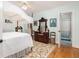 Cozy bedroom with hardwood floors, canopy bed, and ornate wooden furniture creating a vintage aesthetic at 34 Formosa Dr, Charleston, SC 29407