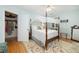 Charming bedroom features a four poster bed, hardwood floors, and neutral tones for a serene retreat at 34 Formosa Dr, Charleston, SC 29407