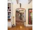 Inviting foyer with hardwood floors, arched doorway, staircase, and decorative accents at 34 Formosa Dr, Charleston, SC 29407