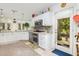 Well-lit kitchen featuring stainless steel appliances and access to backyard at 34 Formosa Dr, Charleston, SC 29407