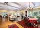 Open floor plan with living room, fireplace, and dining area, accentuated by hardwood floors and natural light at 34 Formosa Dr, Charleston, SC 29407